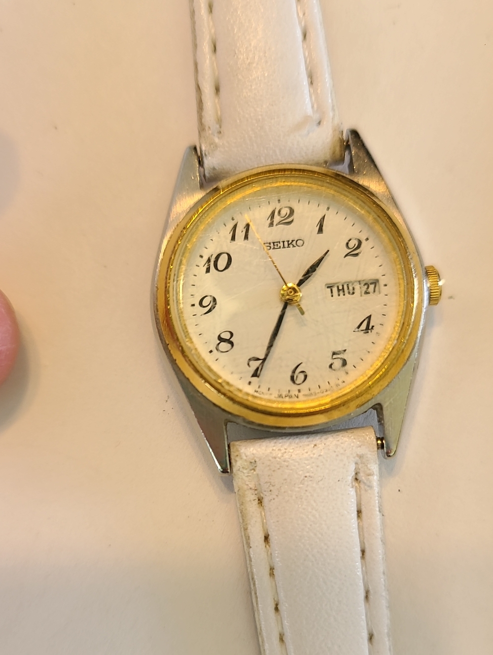 Seiko White Dial Watch with Gold Bezel and White Strap